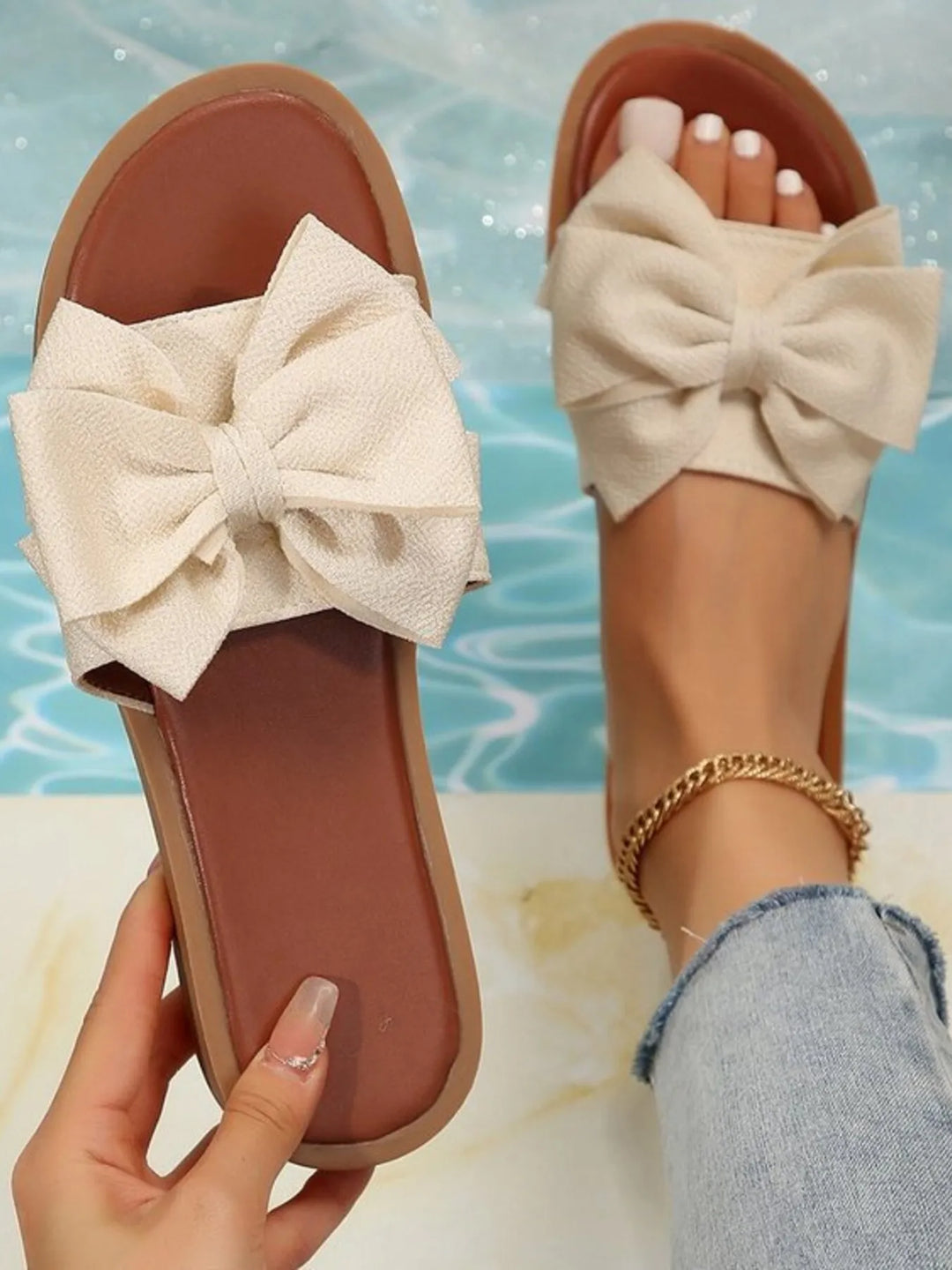 Women's elegant bow flat slide sandals in black, perfect summer footwear for casual or daily wear.