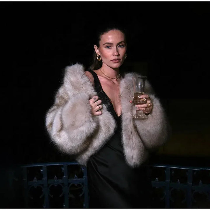 Chic faux fur trimmed hood on a fashionable women's winter coat, perfect for cozy style.