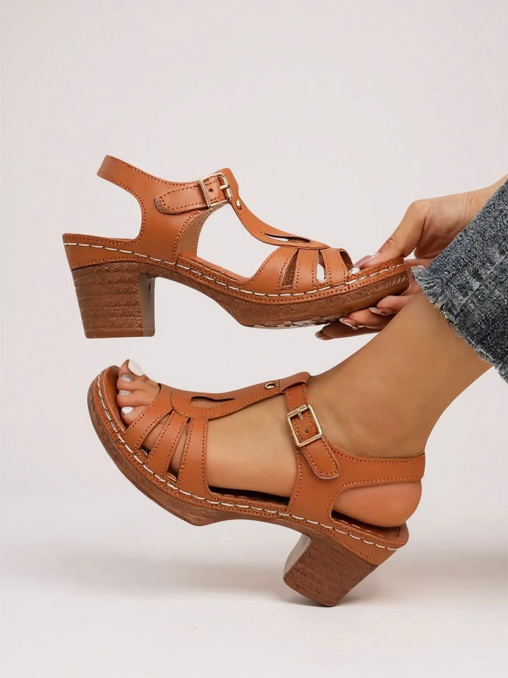 Women's slip-on block heel sandals, combining comfort and chic fashion.