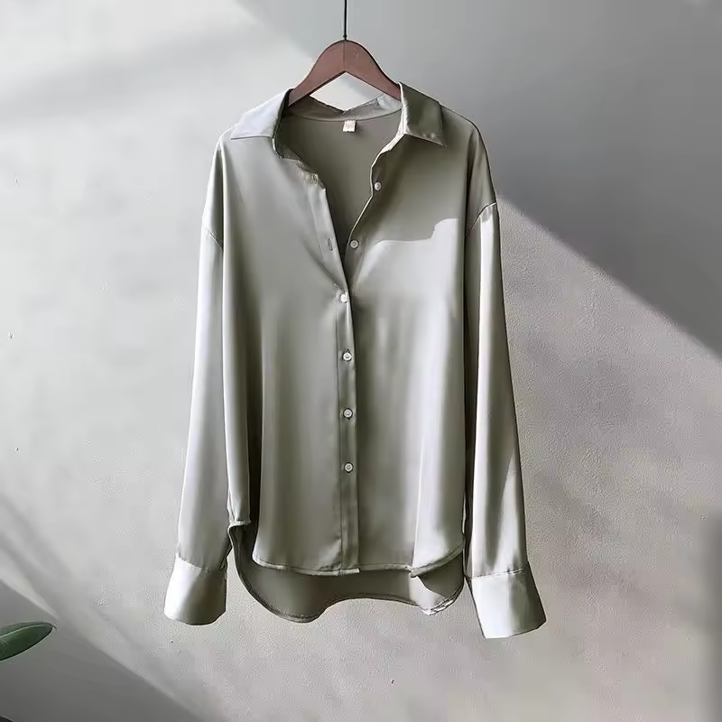 The drape and flow of this versatile women's silk blouse, highlighting its sophisticated design.