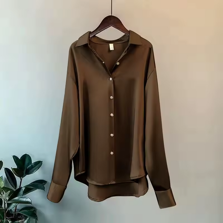 Front view of a women's elegant silk blouse, a timeless and sophisticated top for all occasions.