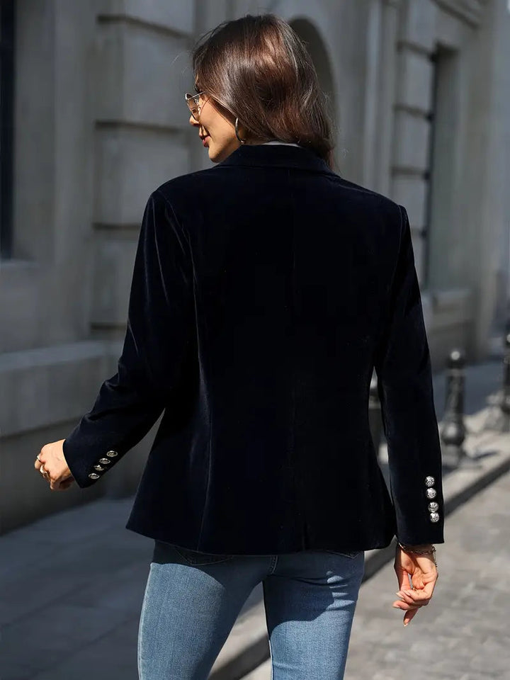Luxurious deep red velvet blazer for women, a chic and tailored outerwear piece.