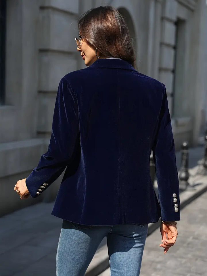Front view of a tailored women's velvet blazer, highlighting its chic silhouette.