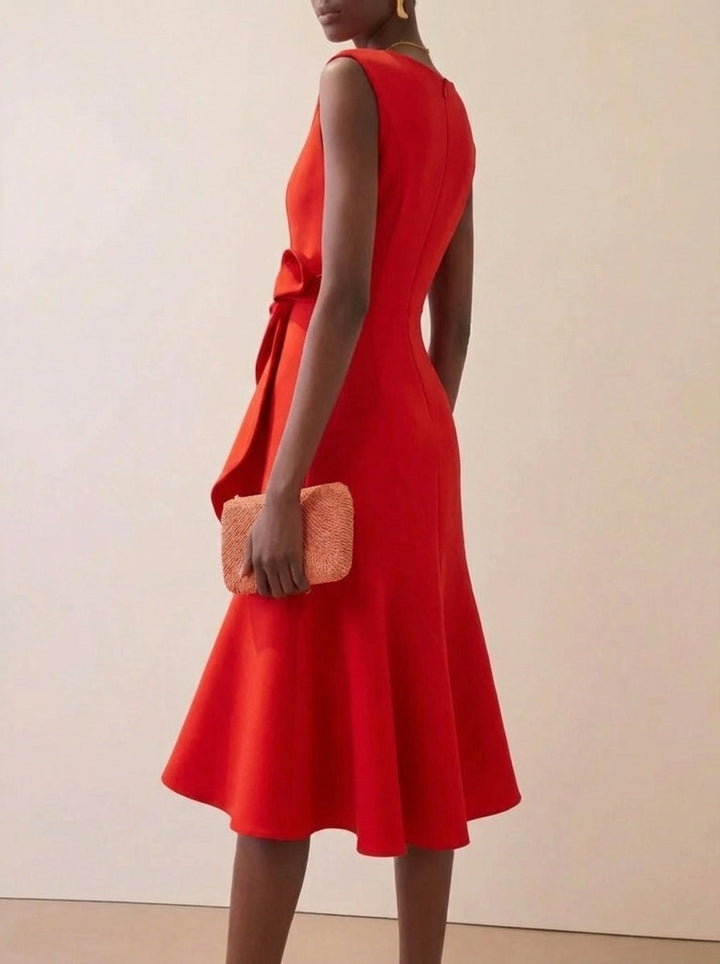 Sleeveless red midi party dress with charming ruffles, ideal for evening events and cocktails.