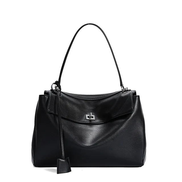 Women's elegant structured fold-over handbag with gold turn-lock closure, perfect midi bag for everyday.