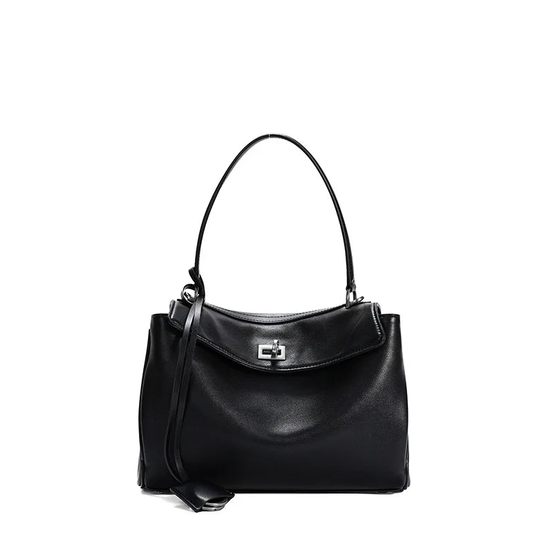 Versatile women's fold-over bag, structured design with turn-lock closure, ideal elegant accessory.