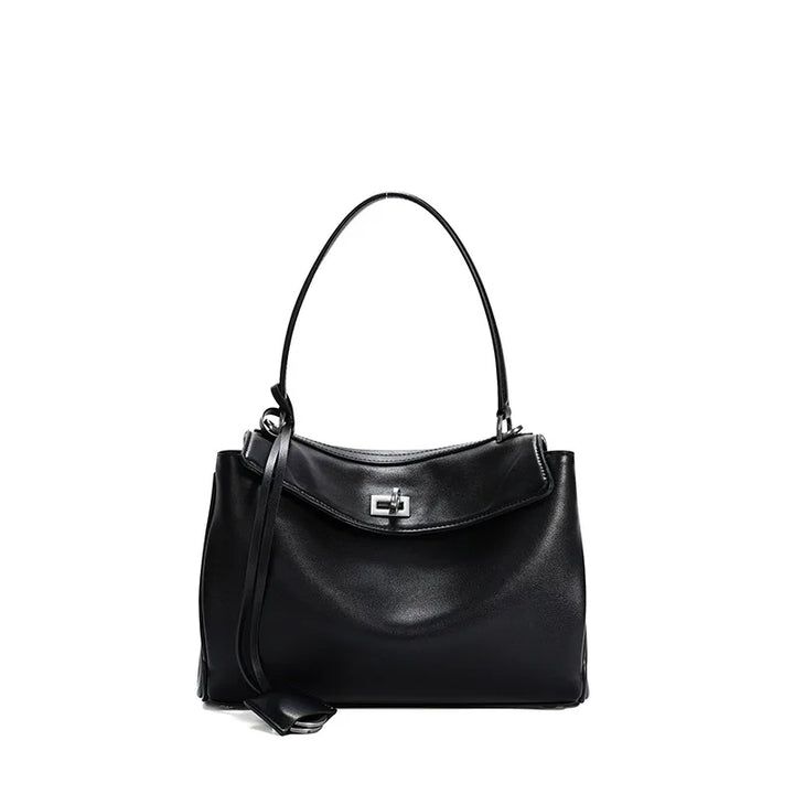 Versatile women's fold-over bag, structured design with turn-lock closure, ideal elegant accessory.