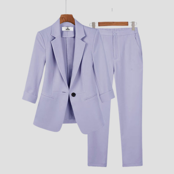 Women's elegant clothing: a sophisticated two-piece blazer and trouser set, offering smart casual style.