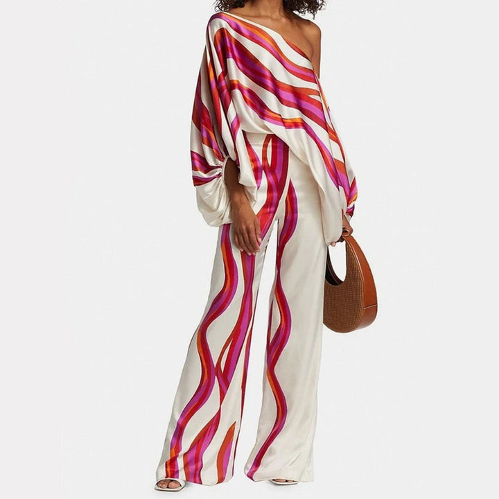 Women's elegant two-piece summer set with playful print, featuring wide leg pants and lantern sleeve top.