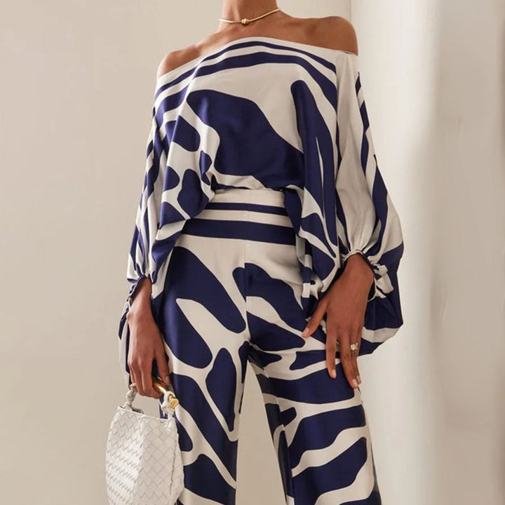 Chic ladies clothing: Summer set featuring playful prints, wide leg pants, and a chic lantern sleeve top.
