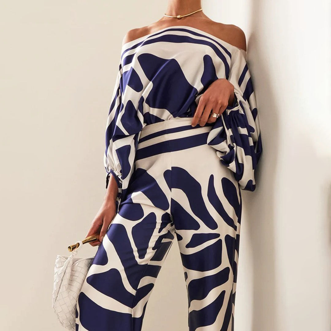 Stylish women's two-piece set for summer, highlighting playful prints and wide leg pant comfort.