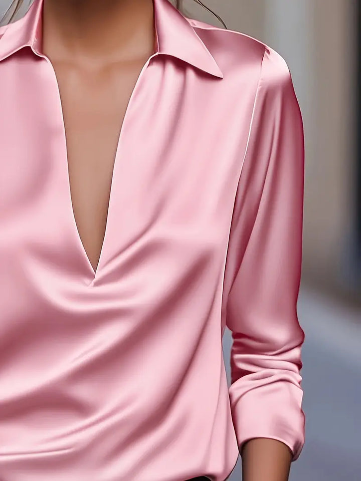 Ladies' flowy V-neck blouse, perfect for a casual chic look or sophisticated office attire.