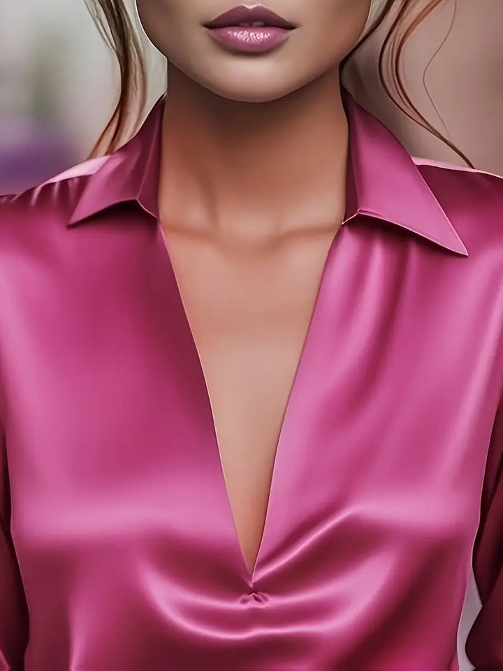 Flowy V-neck ladies' blouse, offering comfort & elegant style for any occasion.