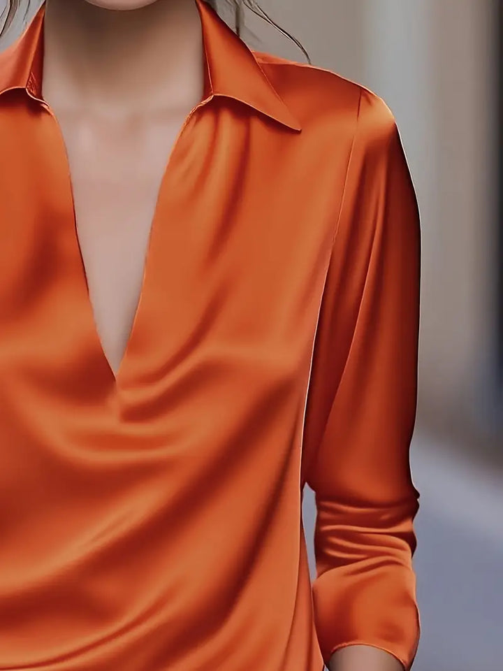 Flowy women's V-neck blouse, a comfortable top for elegant casual wear & professional settings.