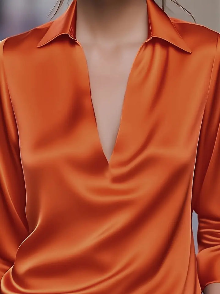 Versatile elegant V-neck top for women, ideal for a polished look in office or leisure.