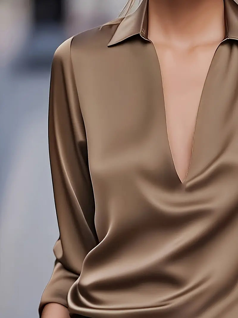 Chic V-neck ladies' blouse, an elegant choice for office wear, casual, or versatile fashion.