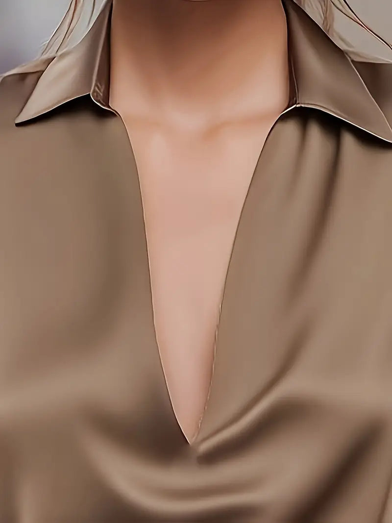 Elegant women's V-neck top, perfect for sophisticated style, from desk to dinner.