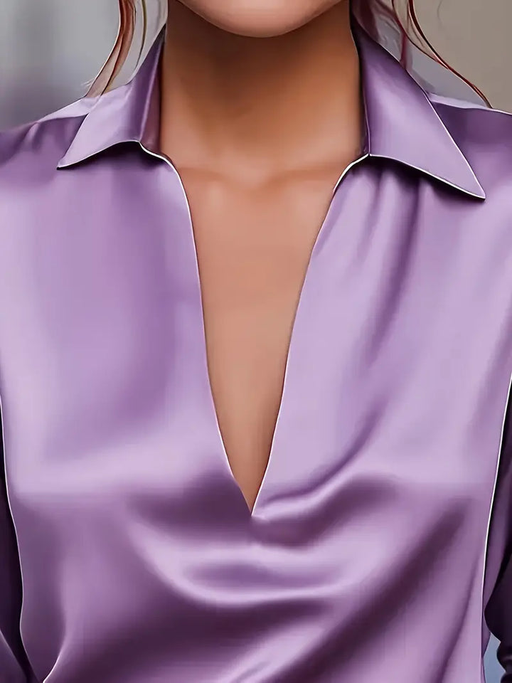 Sophisticated ladies' V-neck blouse, providing elegant comfort & chic style for any outfit.