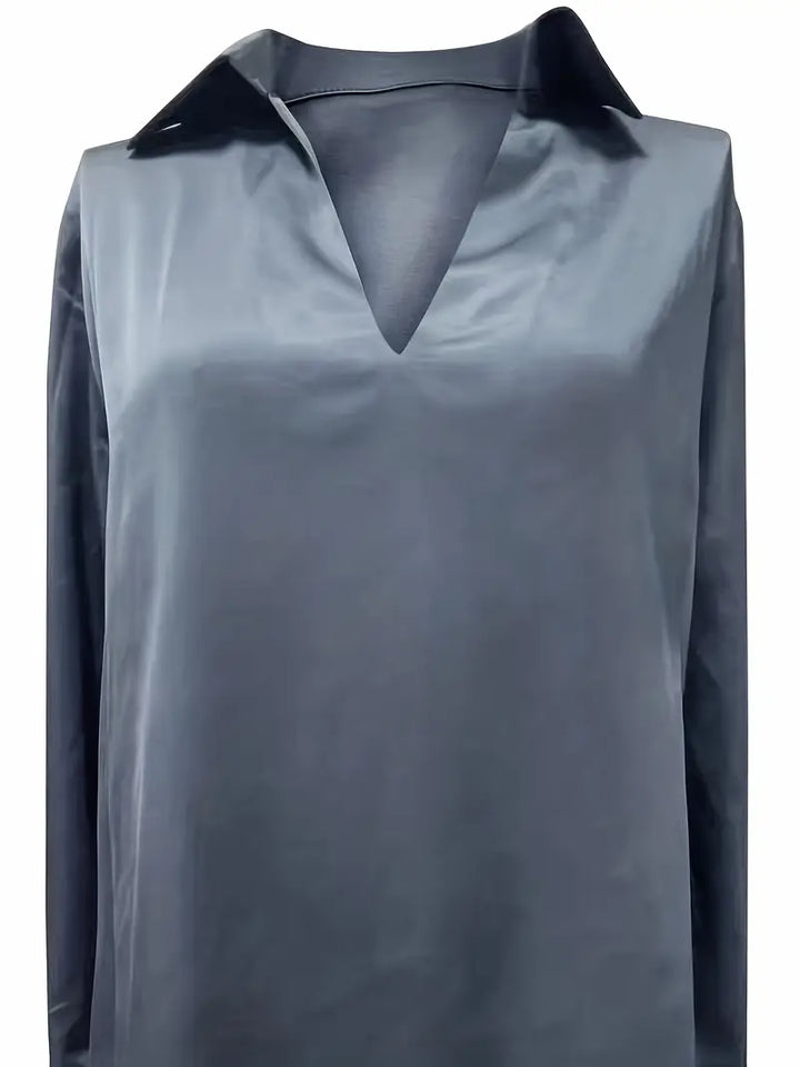 Flowy V-neck ladies' blouse, offering comfort & elegant fashion for any stylish look.