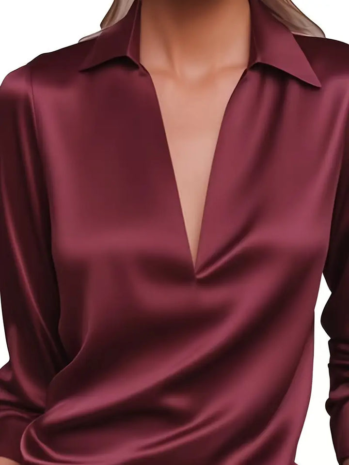 Elegant women's V-neck top, perfect for sophisticated style, from morning meetings to evening.
