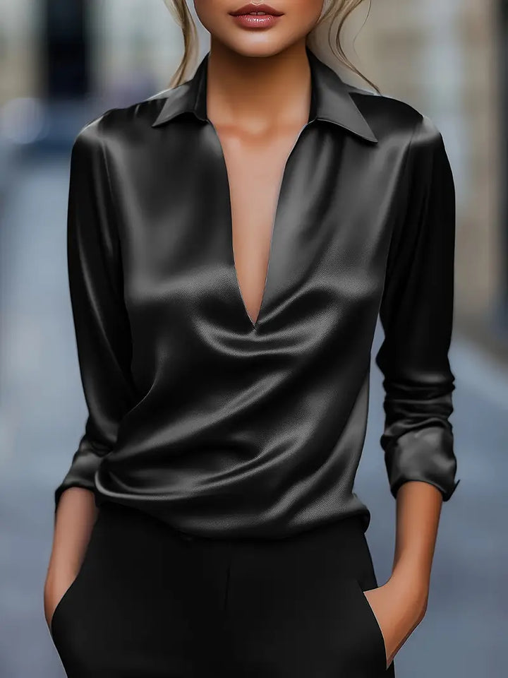 Flowy elegant women's V-neck blouse, comfortable & stylish for modern fashion statements.