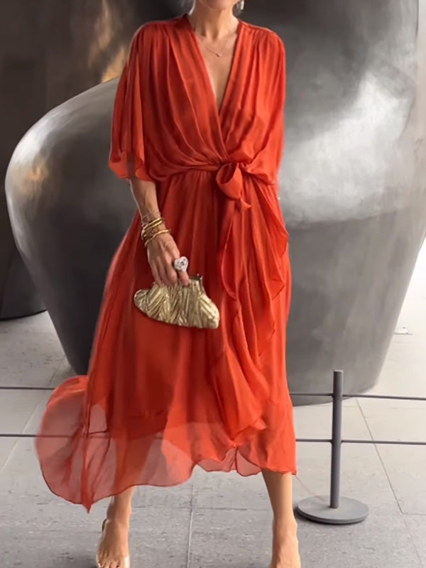 Simple elegant V-neck evening gown, short sleeves, flowing silhouette for women.