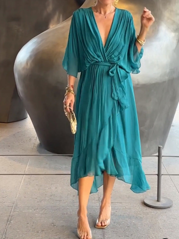 Women's sophisticated short-sleeve V-neck evening gown, elegant flowing skirt.