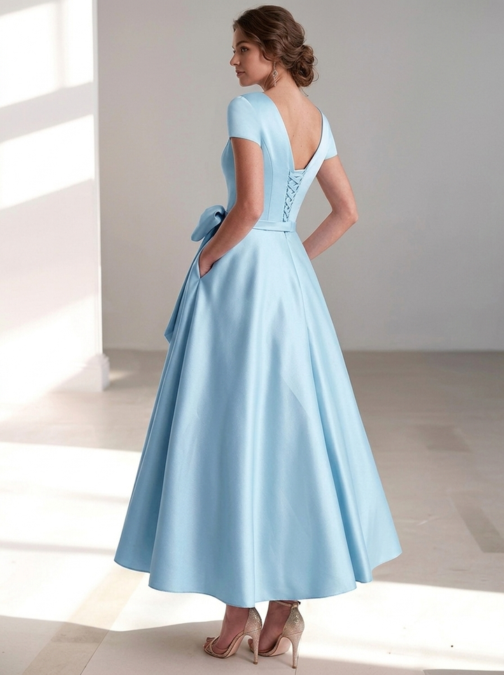 Women's formal midi dress, featuring a graceful V-neckline and elegant bow waist.