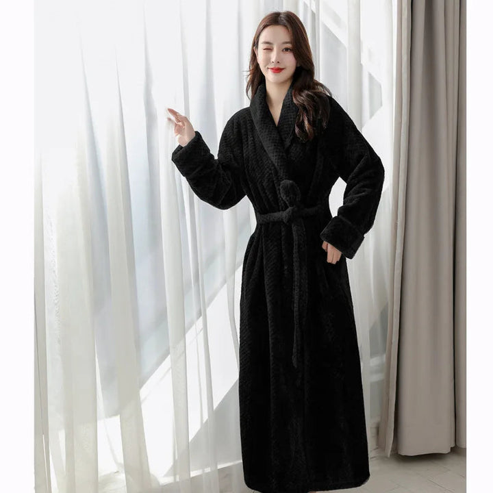 Evi plush bathrobe in a light grey color, offering warmth and relaxation.