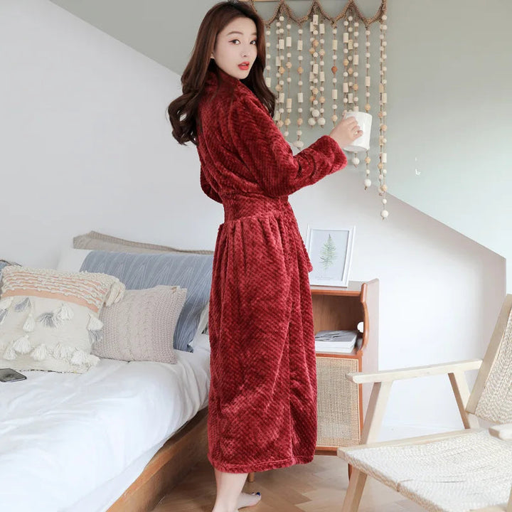 Stylish women's Evi plush robe with pockets, ideal for a cozy evening at home.