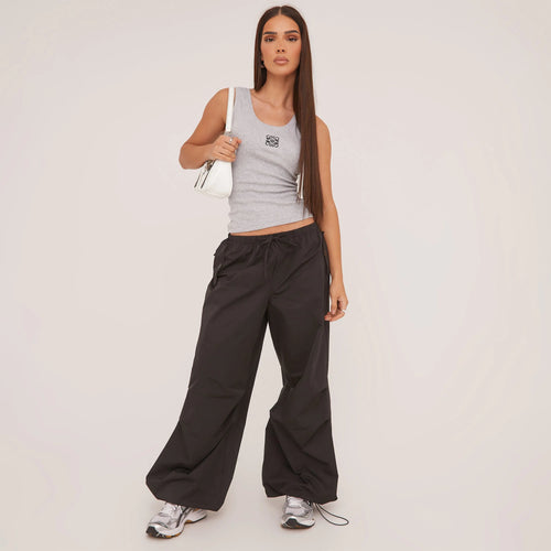 Sleeveless scoop neck tank top for women, offering a comfortable, close fit.