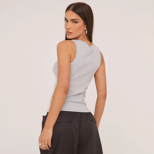 Casual wear essential: a women's racerback tank top with elegant embroidered detail.