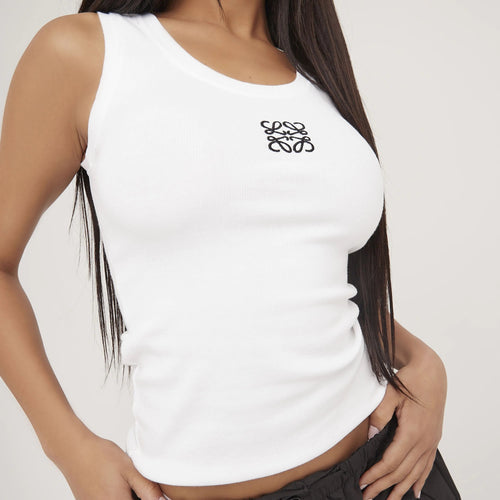 Embroidered detail elevates this women's fitted sleeveless top for a touch of charm.