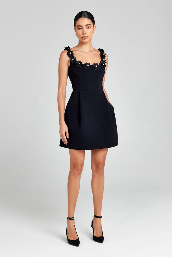 Boho-chic women's summer mini dress with charming floral appliqué details.