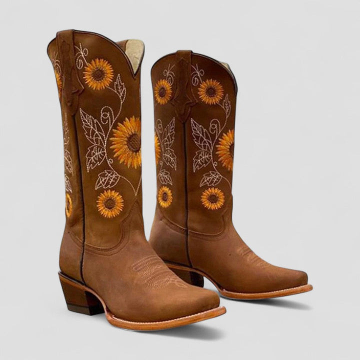Stylish women's ankle boots featuring intricate floral embroidery and a comfortable low heel.
