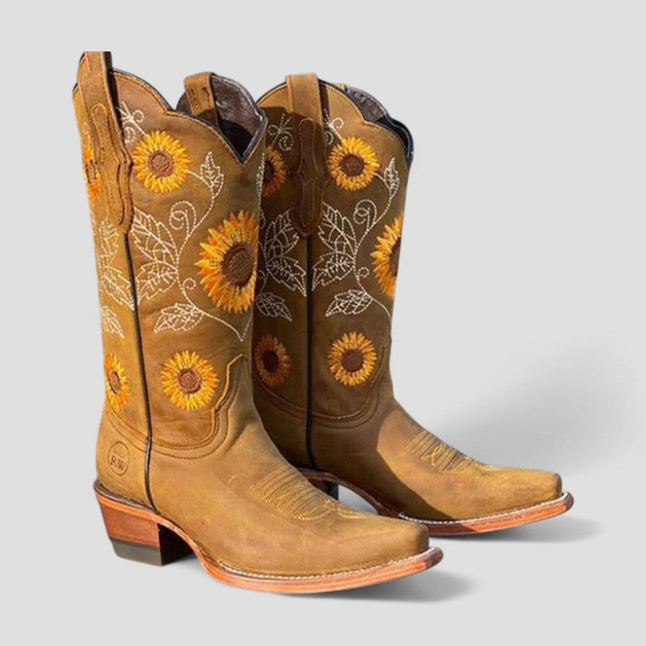 Faux leather cowgirl boots for women with beautiful floral embroidery and a chic low block heel.