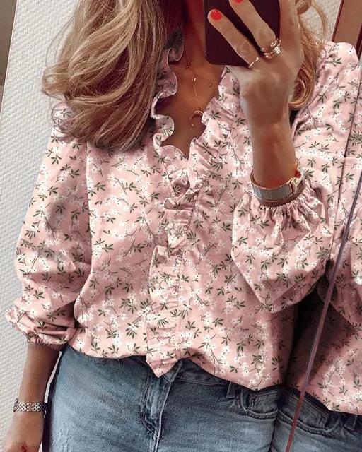 Feminine V-neck blouse with long sleeves and ruffle detail for everyday wear