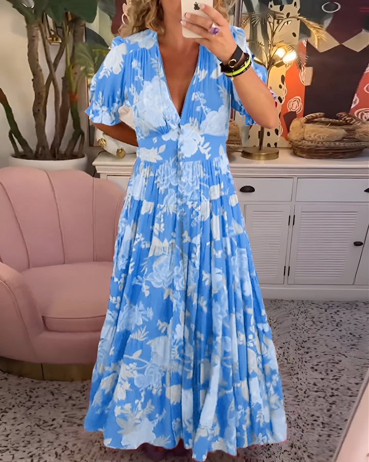 Elegant women's floral V-neck midi dress for spring and summer, ideal for vacation or casual everyday wear.