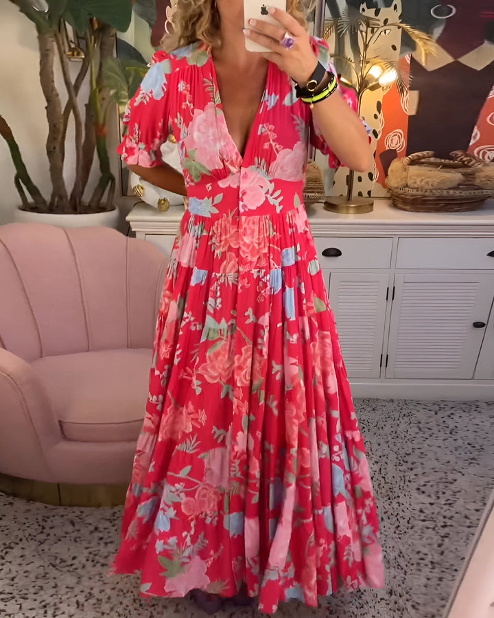 Chic women's floral print V-neck dress, featuring a comfortable midi length & functional pockets for easy style.