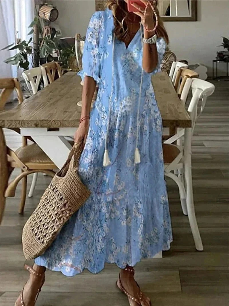 Flowy Luna Boho Maxi Dress for women, featuring a stylish leaf print. Comfortable half sleeve vacation wear.