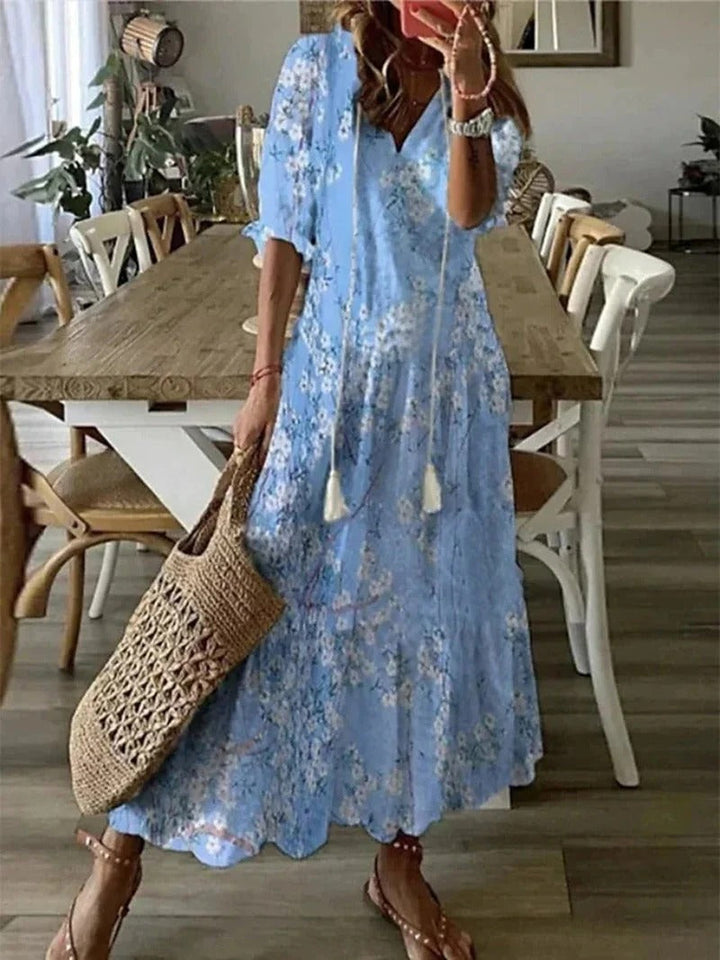 Flowy Luna Boho Maxi Dress for women, featuring a stylish leaf print. Comfortable half sleeve vacation wear.