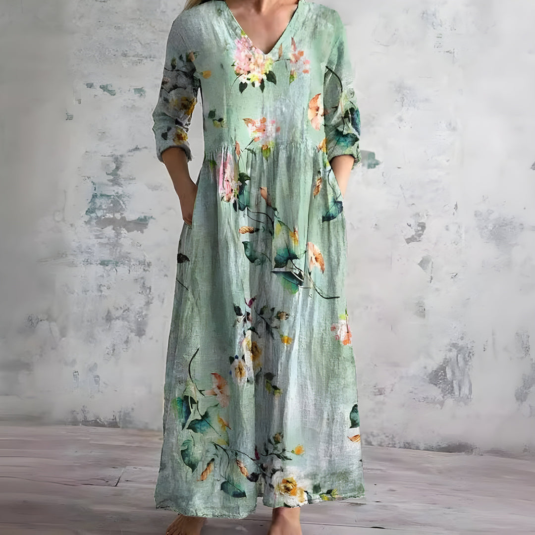 Elegant flowy floral maxi dress for women, featuring a chic V-neck. Perfect comfortable summer attire.
