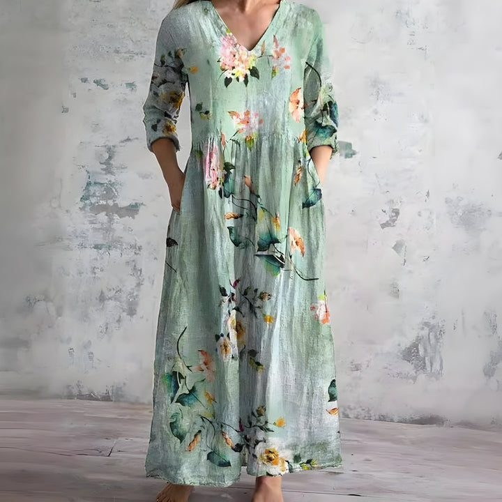 Elegant flowy floral maxi dress for women, featuring a chic V-neck. Perfect comfortable summer attire.