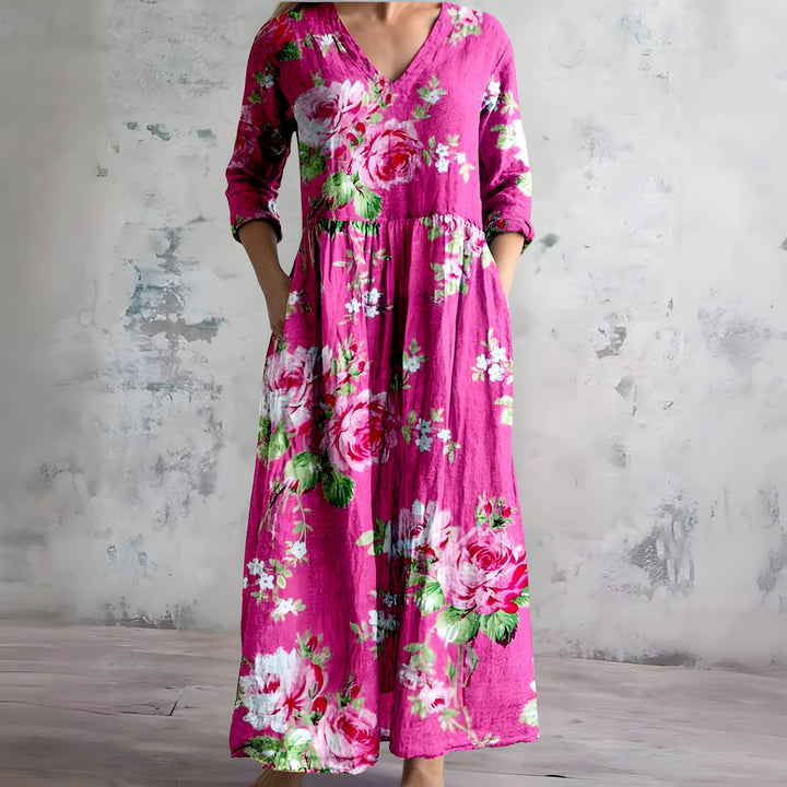 Stylish women's flowy floral maxi dress with a V-neck, designed for comfortable summer elegance.