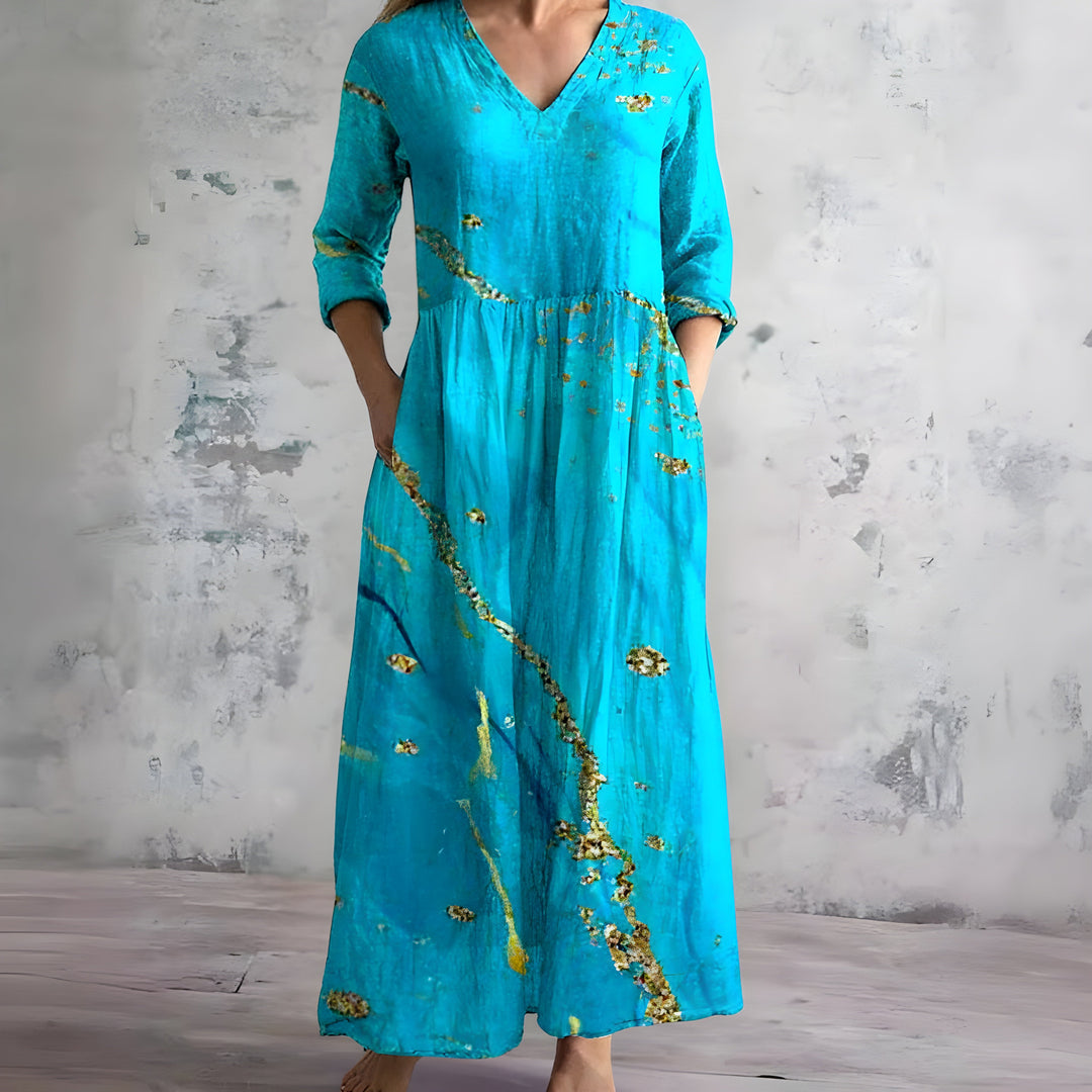 Lightweight flowy floral maxi dress for women, with a stylish V-neck. Perfect comfortable summer fashion.