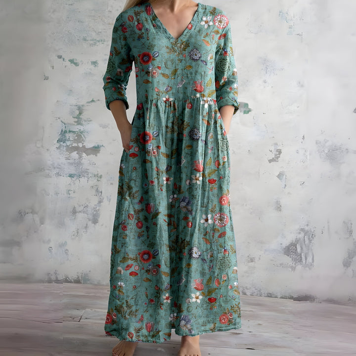 Chic women's summer V-neck maxi dress in a beautiful floral print. Flowy and comfortable vacation dress.