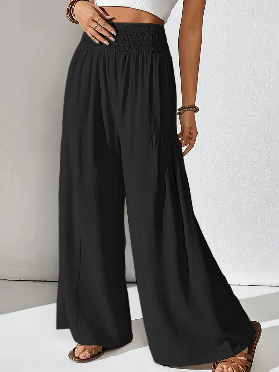 Versatile travel pants: women's smocked waist wide leg pants in a breathable fabric.
