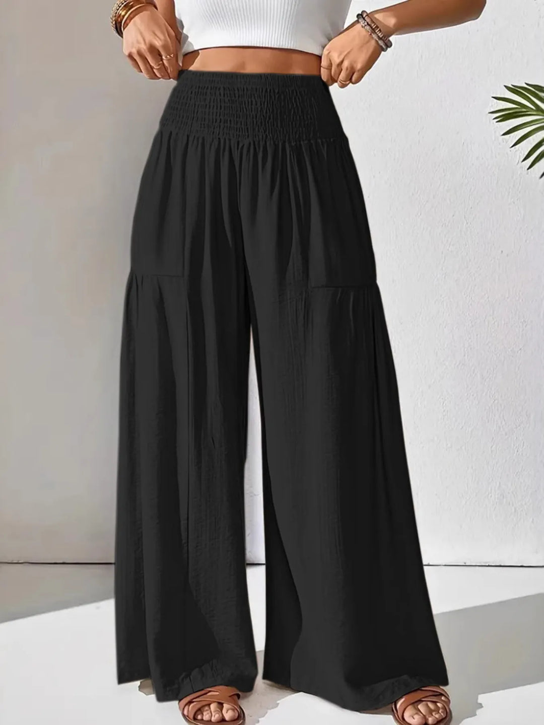 Comfortable and chic: women's wide leg pants with a high smocked waist for easy styling.