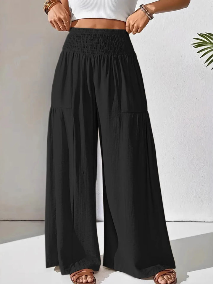 Comfortable and chic: women's wide leg pants with a high smocked waist for easy styling.
