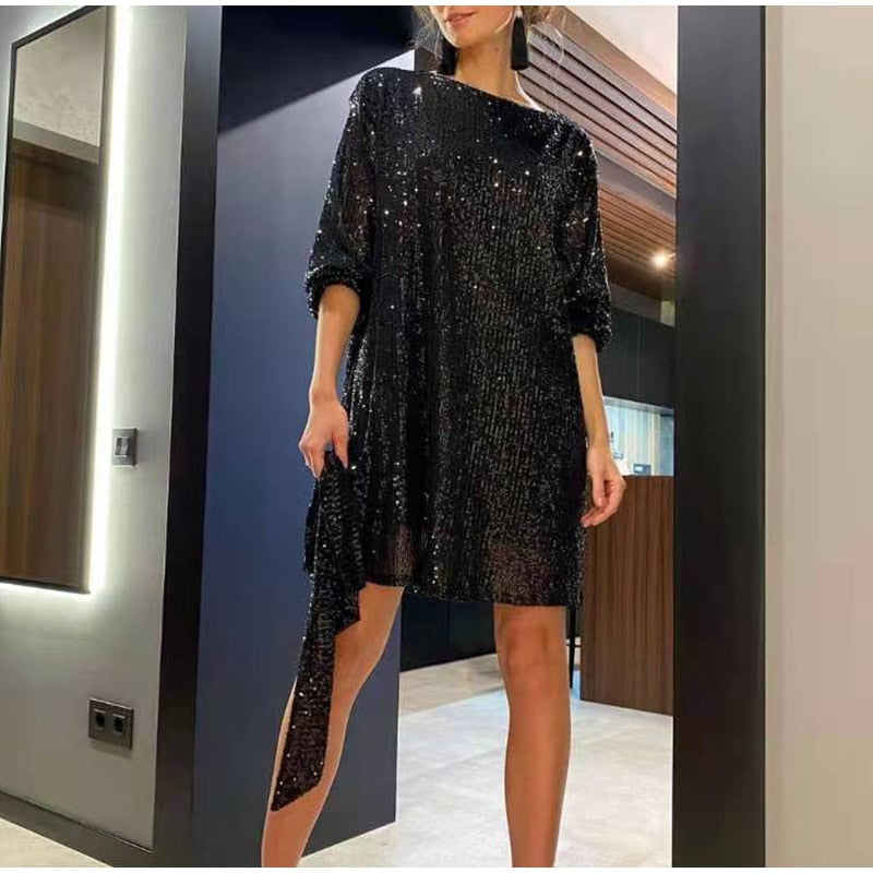 Elegant long sleeve cocktail dress adorned with shimmering sequins for a night out.
